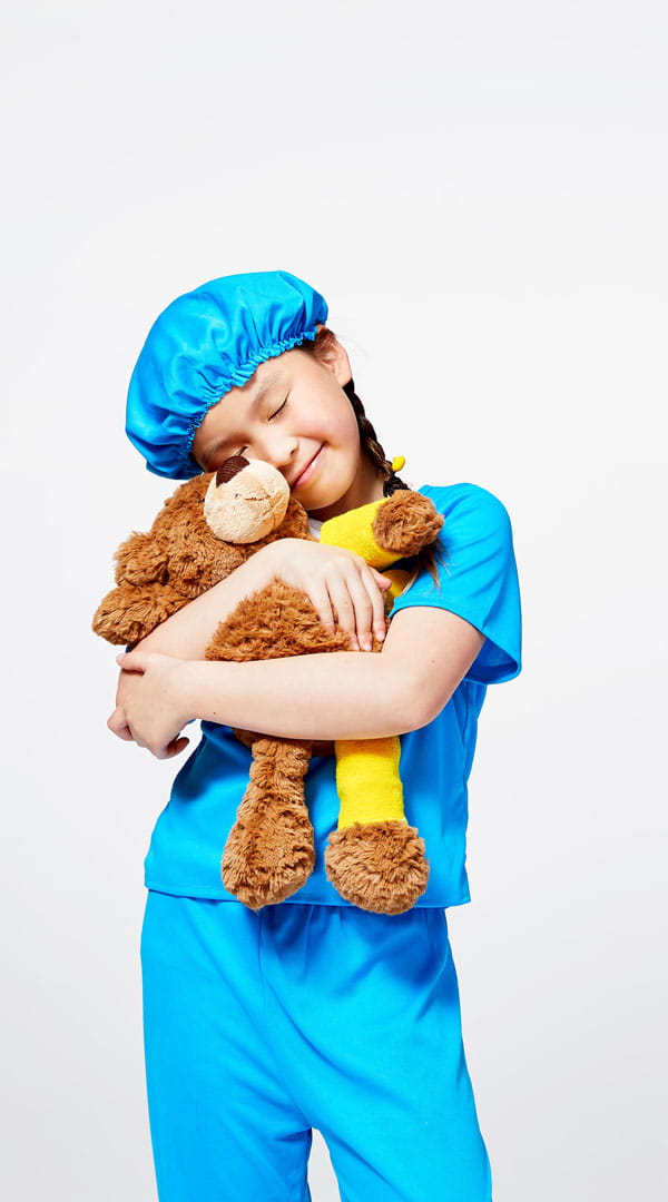 Starship kid hugging teddy bear