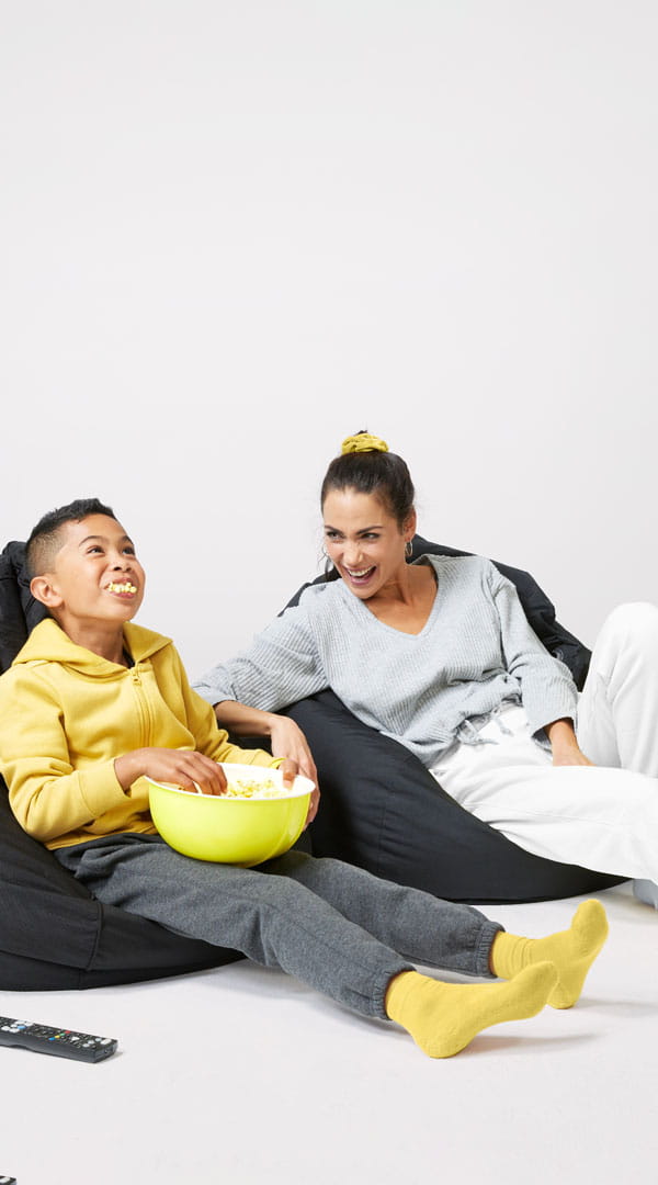 Mum and Child chill out on beanbags with popcorn