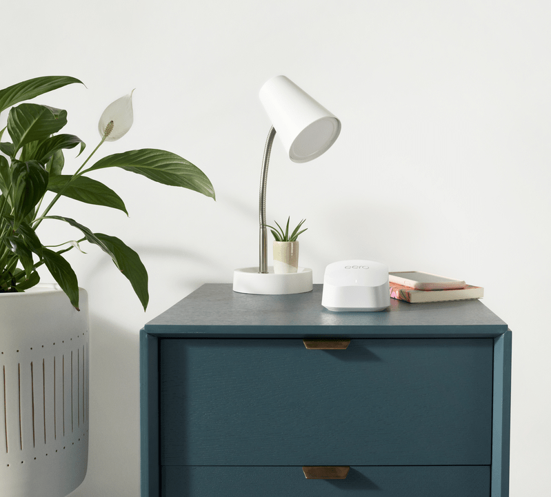 eero router on a bedside table