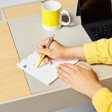 Girl writing at desk