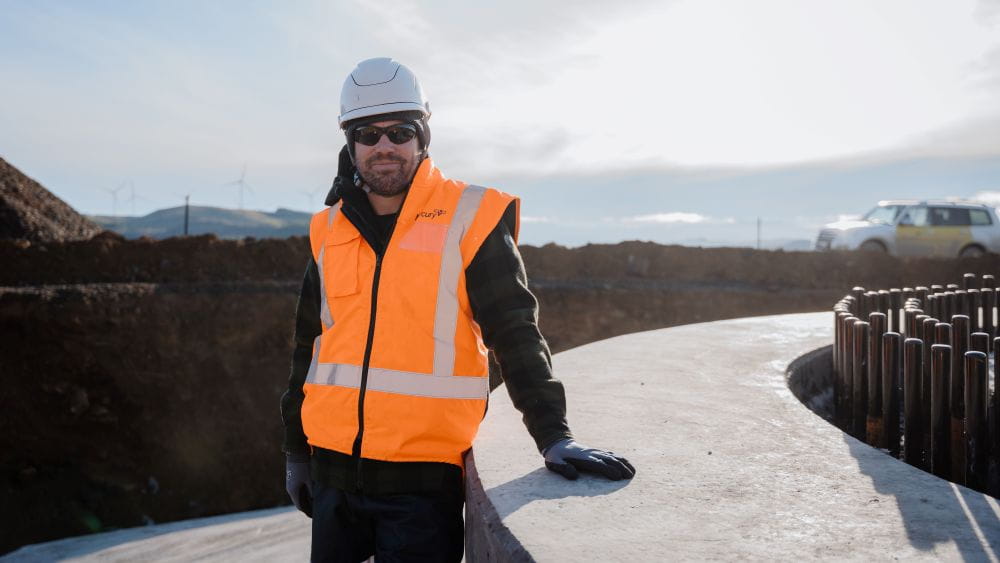 Steward Reid in PPE on construction site of Kaiwera Downs explansion