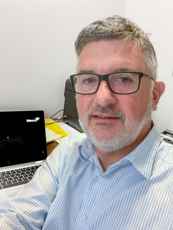 Man sitting in front of laptop.