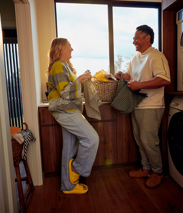 Couple chatting over laundry.