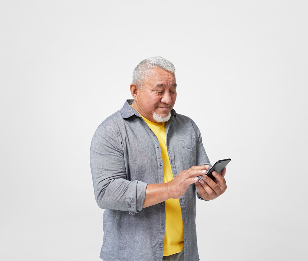 Man looking at iphone.