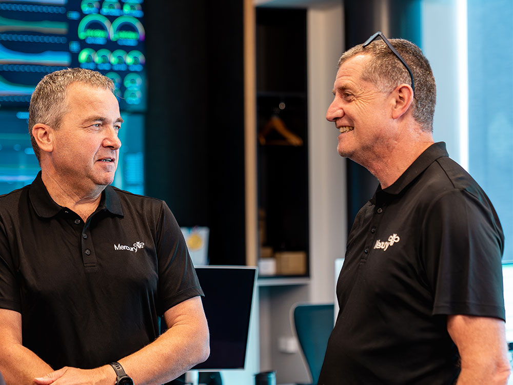 Team collaborating at network operations centre.